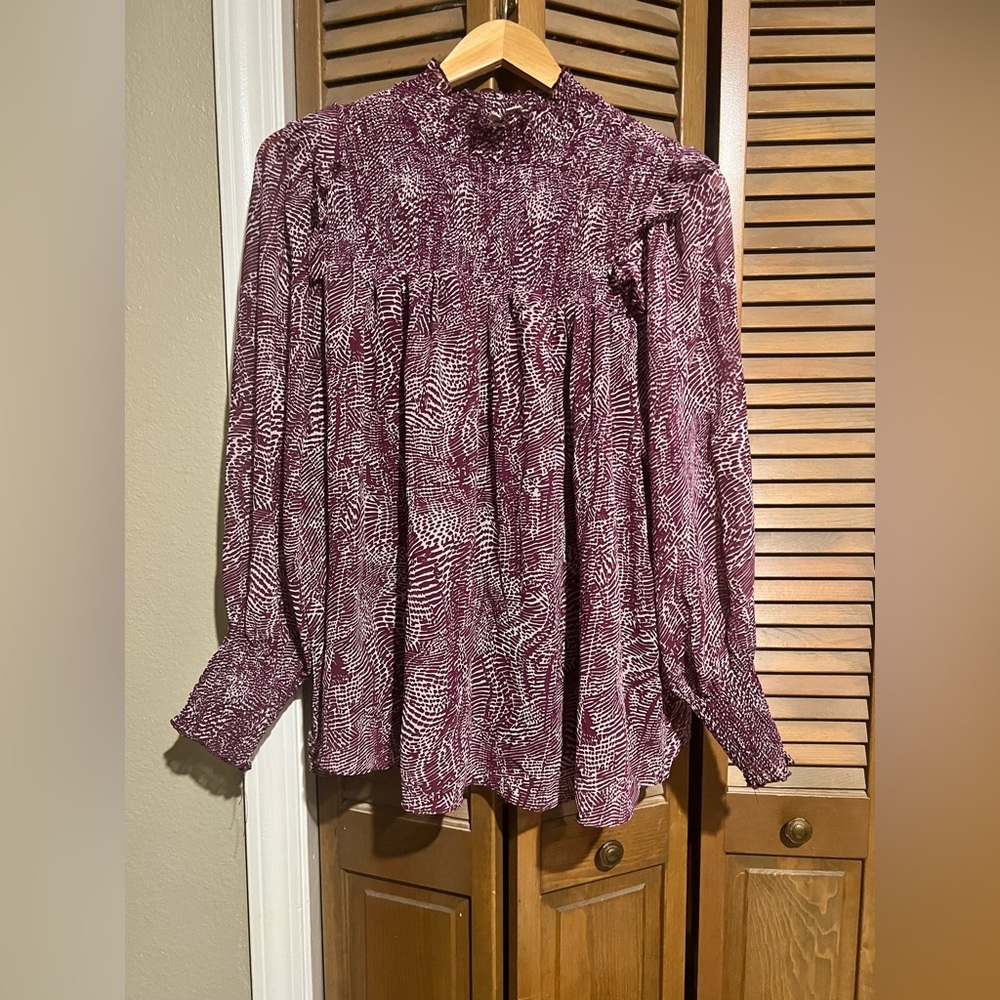 Purple blouse that’s perfect for casual or business attire.